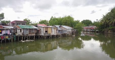 Informal housing settlements along waterways in Iloilo City, Philippines.