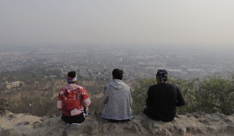 A group looks over a hazy Mexico City, Mexico, from the top of Cerro de la Estrella in April 2021. Days earlier, the city registered an ozone concentration of 160 parts per billion.