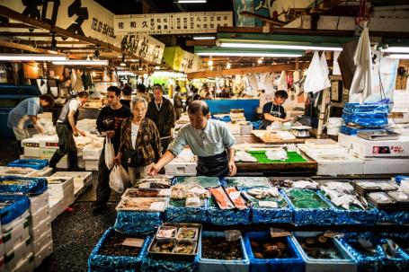 Shoppers peruse a busy fish market in Tokyo.